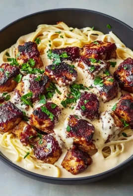Garlic Butter Chicken Bites with Creamy Parmesan Pasta Plated