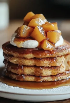 Peach Cobbler Pancakes with Fresh Peaches and Whipped Cream