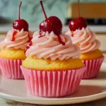 TROPICAL PINEAPPLE CUPCAKES WITH CHERRY BUTTERCREAM BLISS
