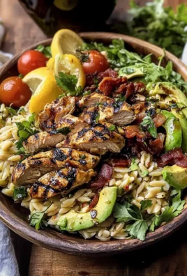 Grilled Lemon Herb Chicken Avocado Orzo Salad with Honey Mustard Bacon Dressing.